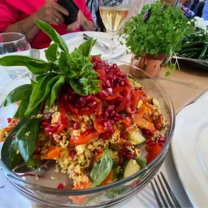 Orange Cous Cous with Roasted Vegetable Confetti, Pomegranate Pearls, Balsamic Onion & Fresh Herbs