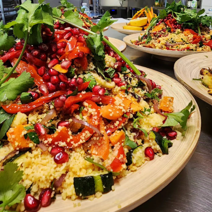 Orange Cous Cous with Roasted Vegetable Confetti, Pomegranate Pearls, Balsamic Onion & Fresh Herbs